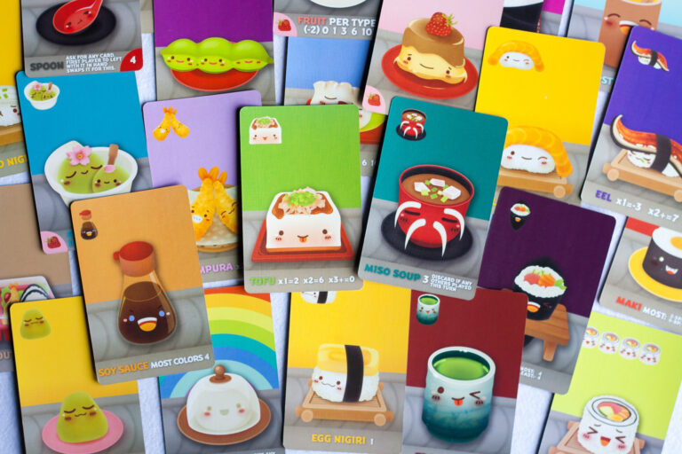 An assortment of game cards from the game Sushi Go Party, featuring anthropomorphised versions of common Japanese foods.