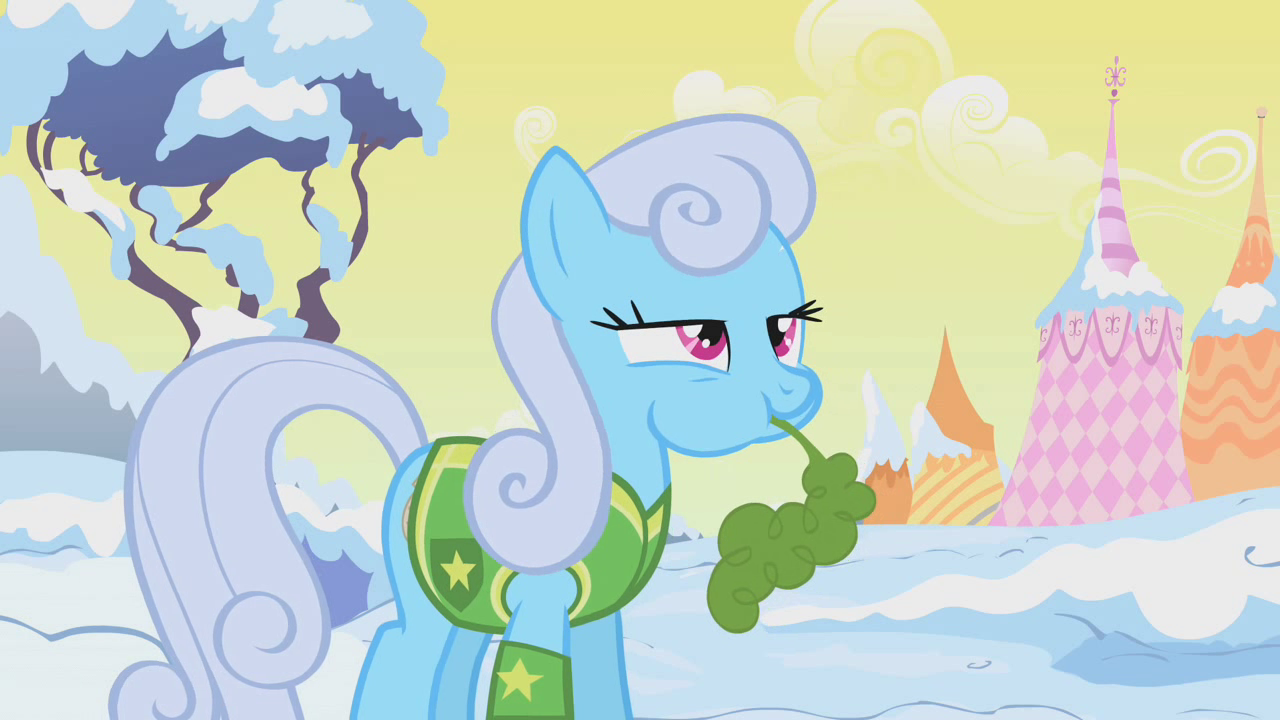 Background pony Shoeshine standing in the middle of a snow-covered landscape, absent-mindedly eating a carrot.